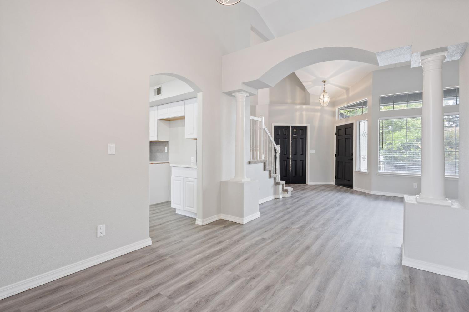 7300 Saltgrass Way Elk Grove, CA 95758 - Photo 9 of 35 wooden floor in an empty room with a window