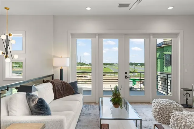 an aerial view of a house with a big yard