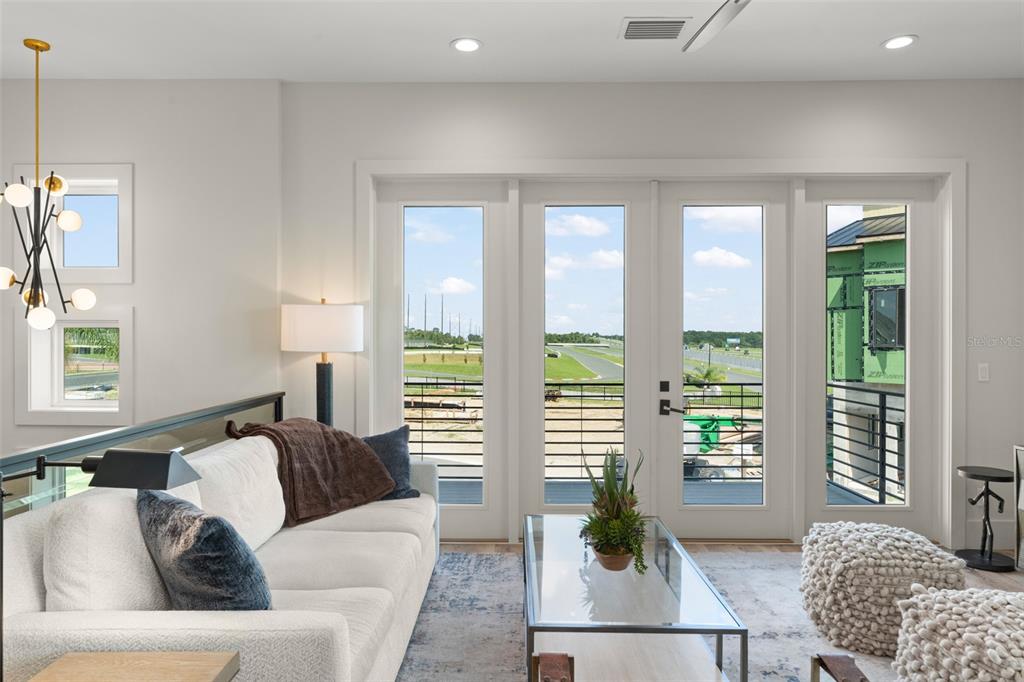 396 Chicane Circle, Unit 5 Auburndale, FL 33823 - Photo 11 of 62 a living room with furniture and a potted plant