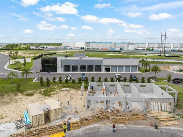 a view of a swimming pool with lawn chairs