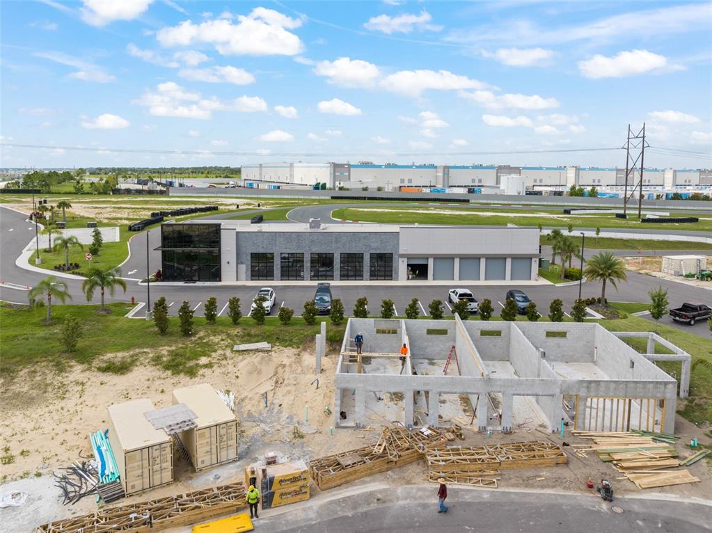 396 Chicane Circle, Unit 5 Auburndale, FL 33823 - Photo 19 of 62 a front view of a house with a garden and lake view