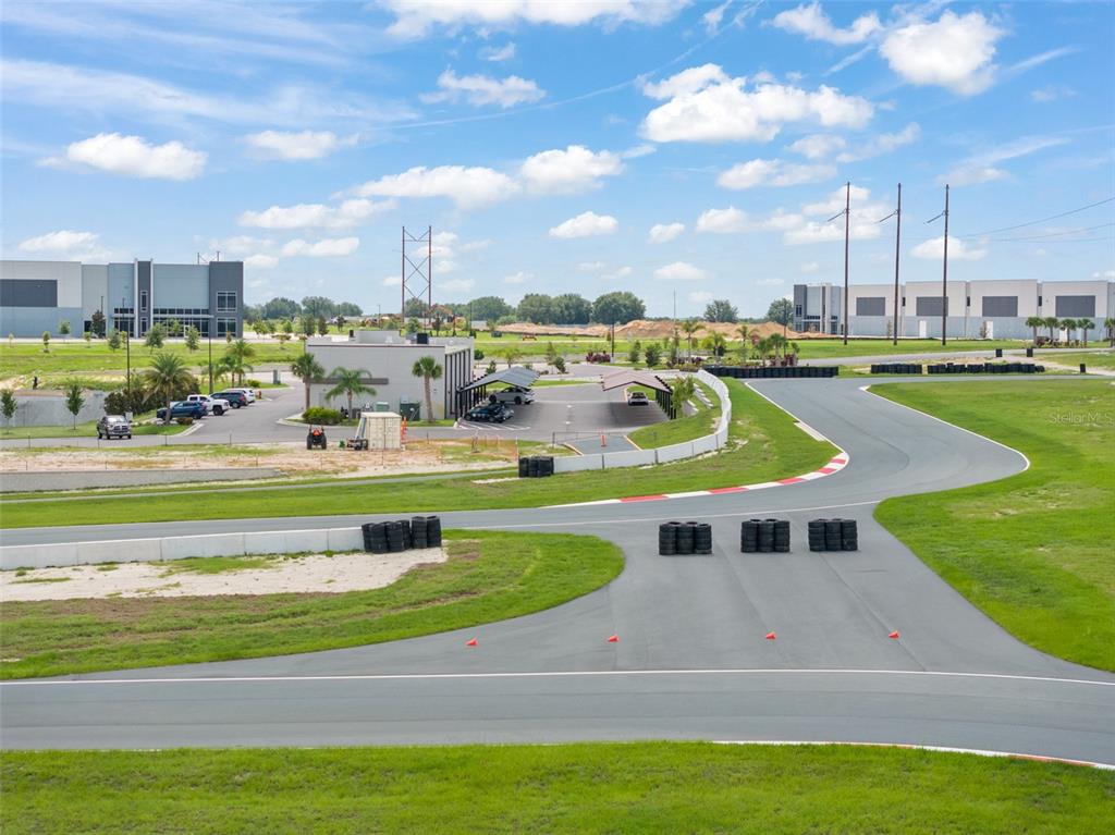 396 Chicane Circle, Unit 5 Auburndale, FL 33823 - Photo 26 of 62 a view of a swimming pool with lawn chairs