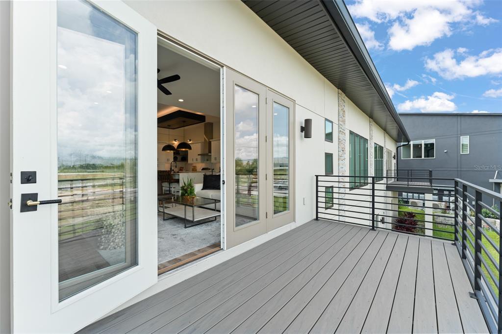 396 Chicane Circle, Unit 5 Auburndale, FL 33823 - Photo 39 of 62 a balcony with wooden floor