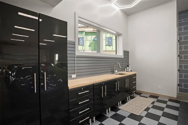 a living room with furniture gym equipment and a large window