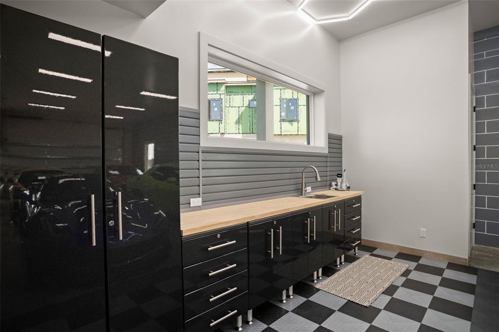 396 Chicane Circle, Unit 5 Auburndale, FL 33823 - Photo 44 of 62 a bathroom with a sink and a mirror