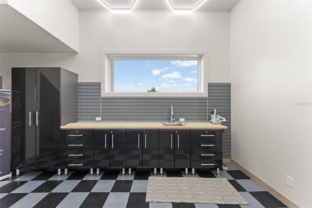 396 Chicane Circle, Unit 5 Auburndale, FL 33823 - Photo 45 of 62 a bathroom with a sink and a mirror