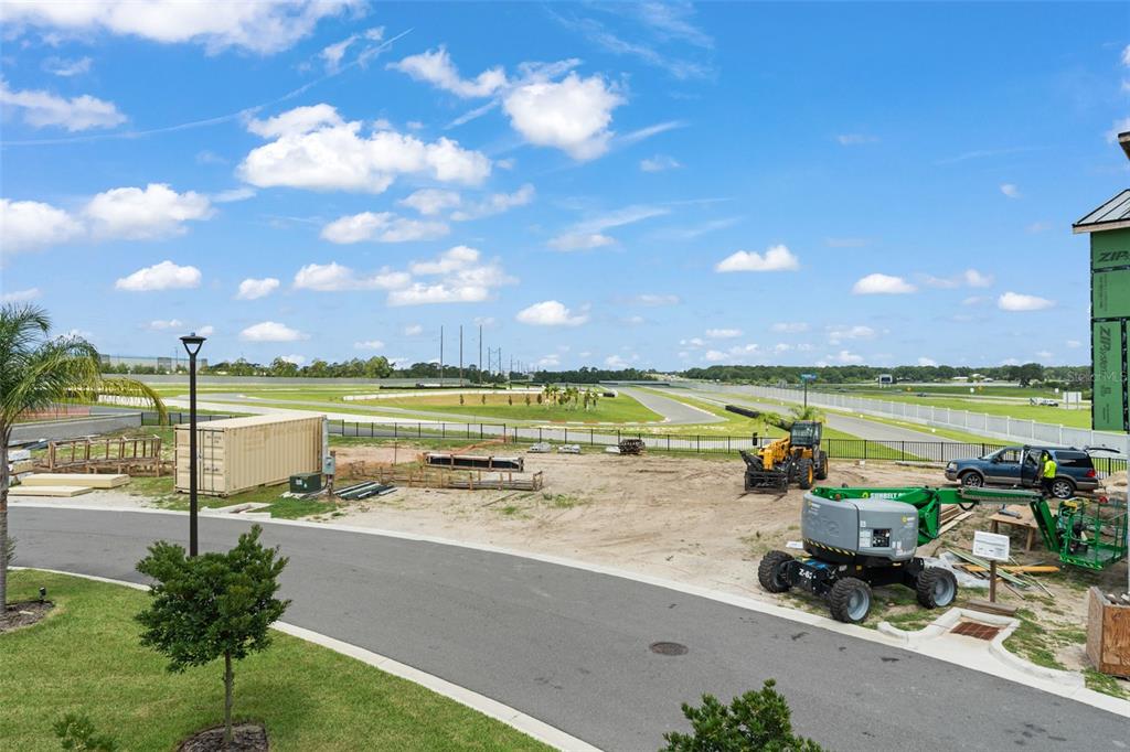 396 Chicane Circle, Unit 5 Auburndale, FL 33823 - Photo 47 of 62 a view of a lake with a yard