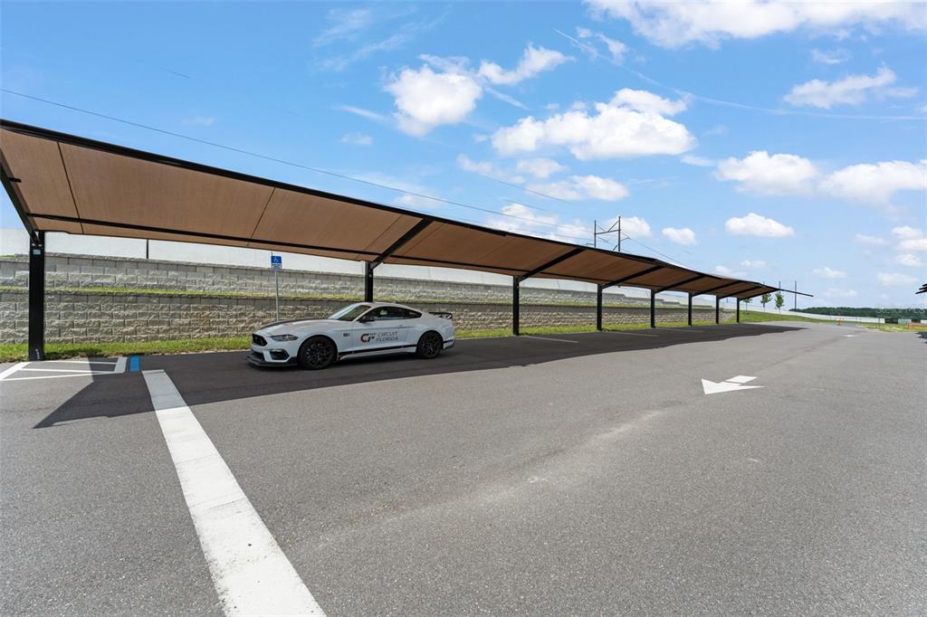 396 Chicane Circle, Unit 5 Auburndale, FL 33823 - Photo 50 of 62 a view of swimming pool with outdoor seating