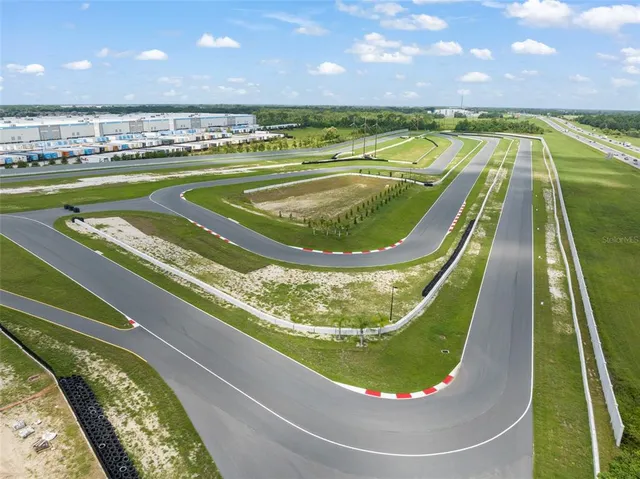 a kitchen with white cabinets and appliances
