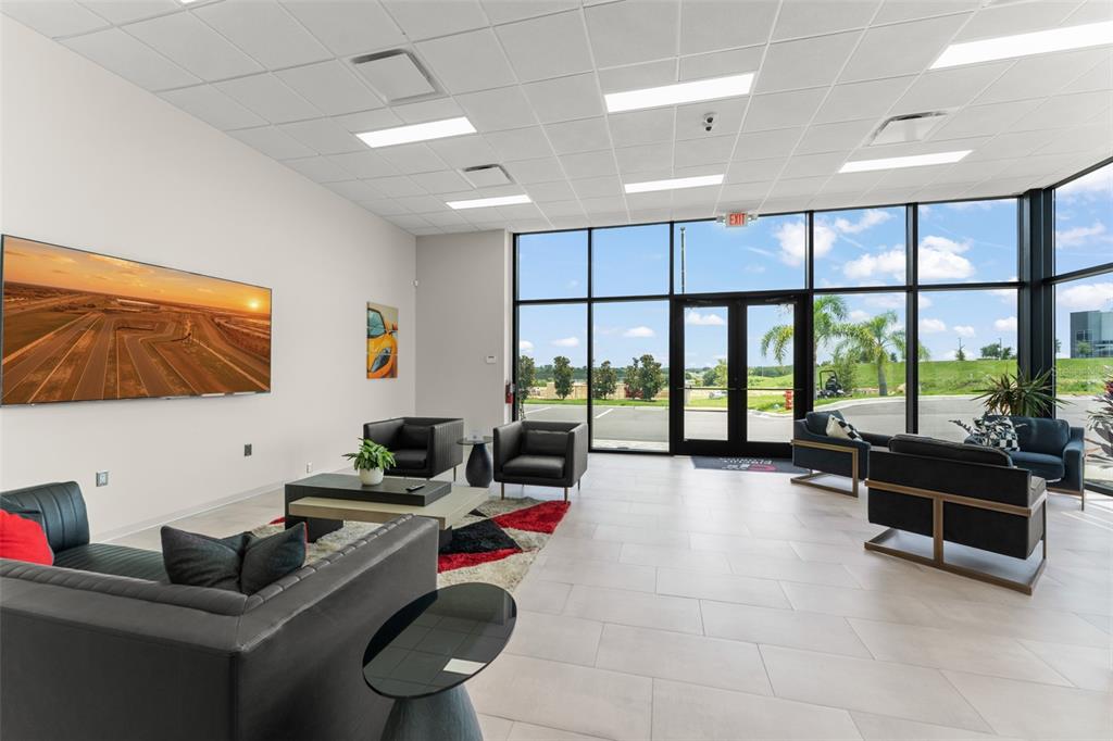 396 Chicane Circle, Unit 5 Auburndale, FL 33823 - Photo 54 of 62 a living room with furniture and a flat screen tv