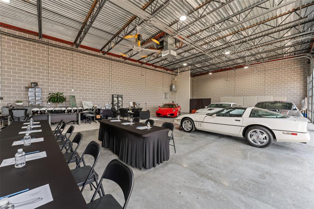 396 Chicane Circle, Unit 5 Auburndale, FL 33823 - Photo 61 of 62 a view of parking garage with cars and other equipment