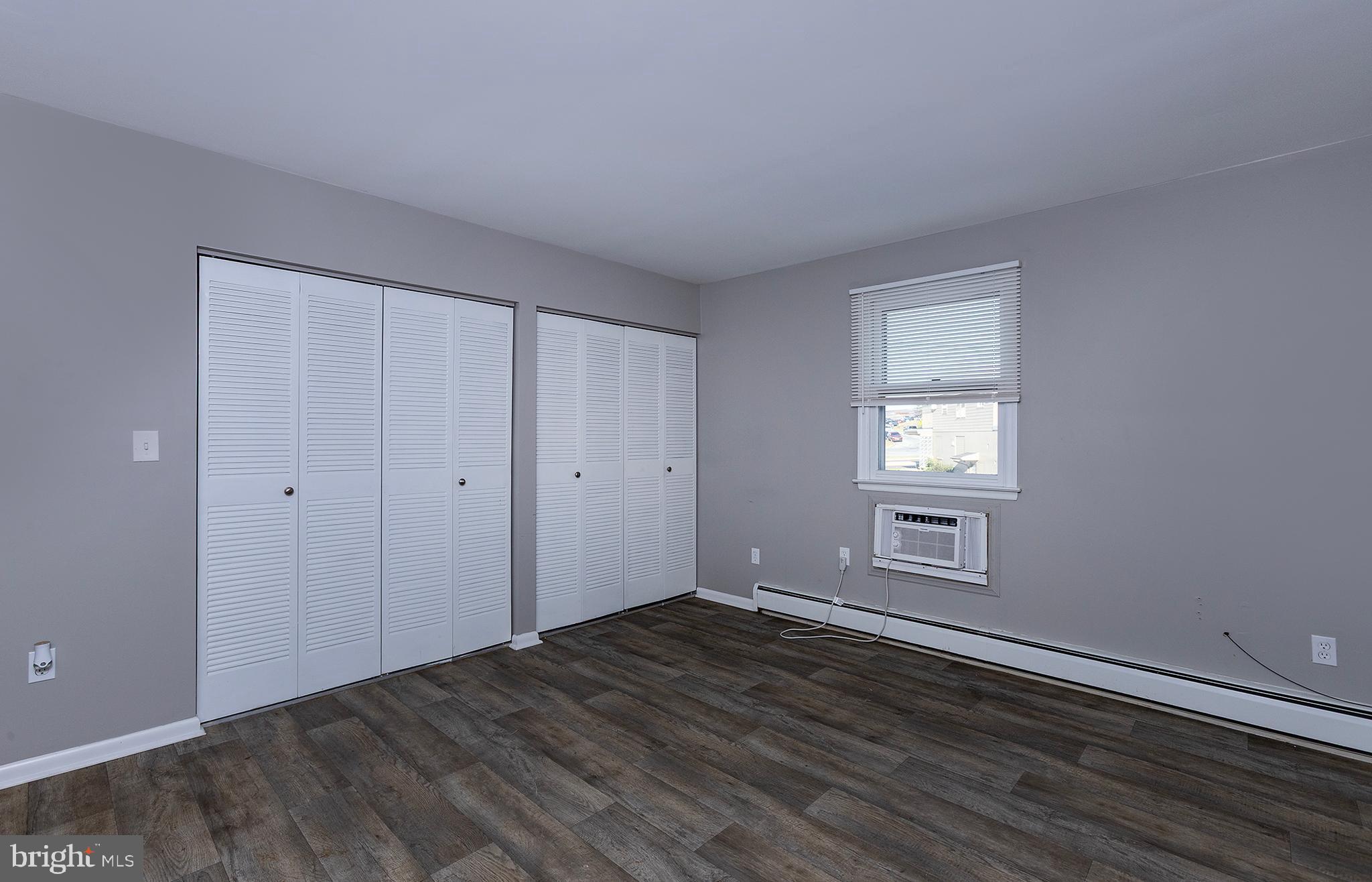110 Sunset Avenue, Unit 201 Harrisburg, PA 17112 - Photo 11 of 22 a view of empty room with wooden floor and fan