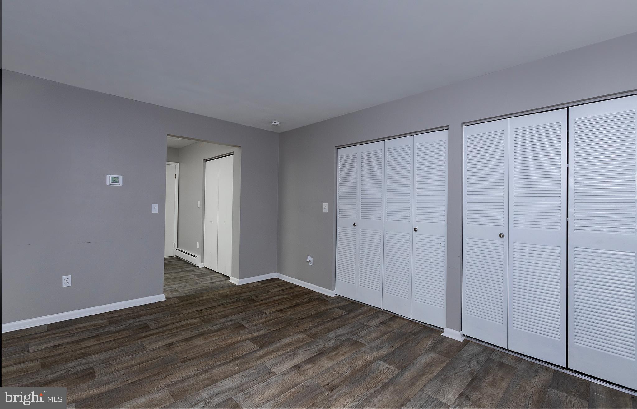 110 Sunset Avenue, Unit 201 Harrisburg, PA 17112 - Photo 13 of 22 a view of an empty room with wooden floor