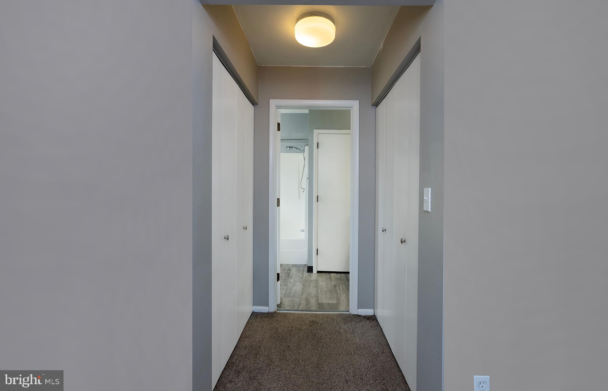 110 Sunset Avenue, Unit 201 Harrisburg, PA 17112 - Photo 19 of 22 a view of a hallway with wooden shelves