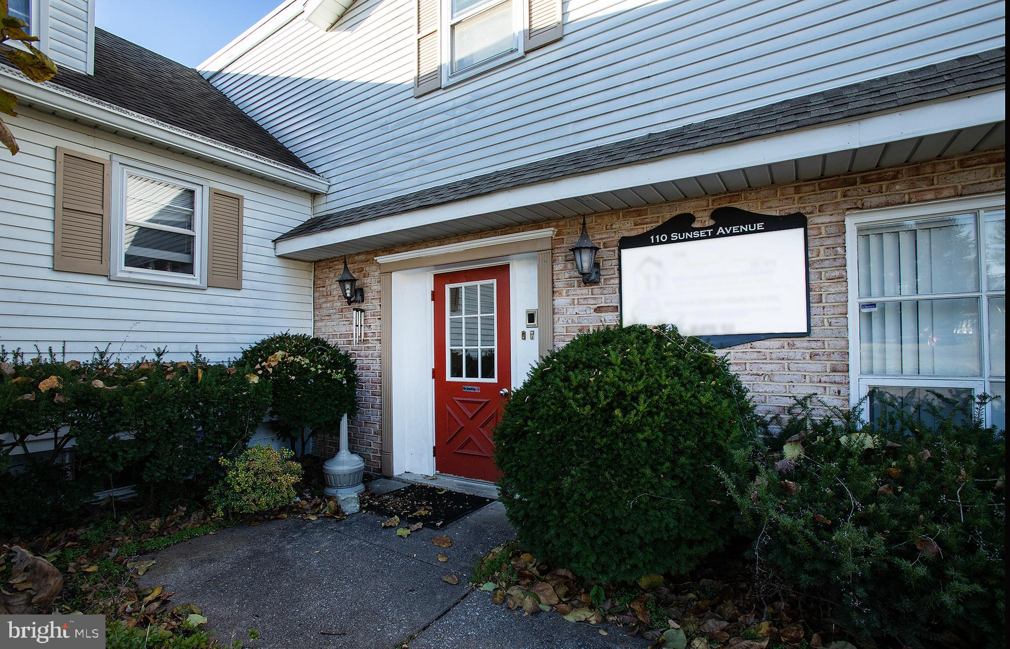 110 Sunset Avenue, Unit 201 Harrisburg, PA 17112 - Photo 4 of 22 a backyard of a house with plants and outdoor seating