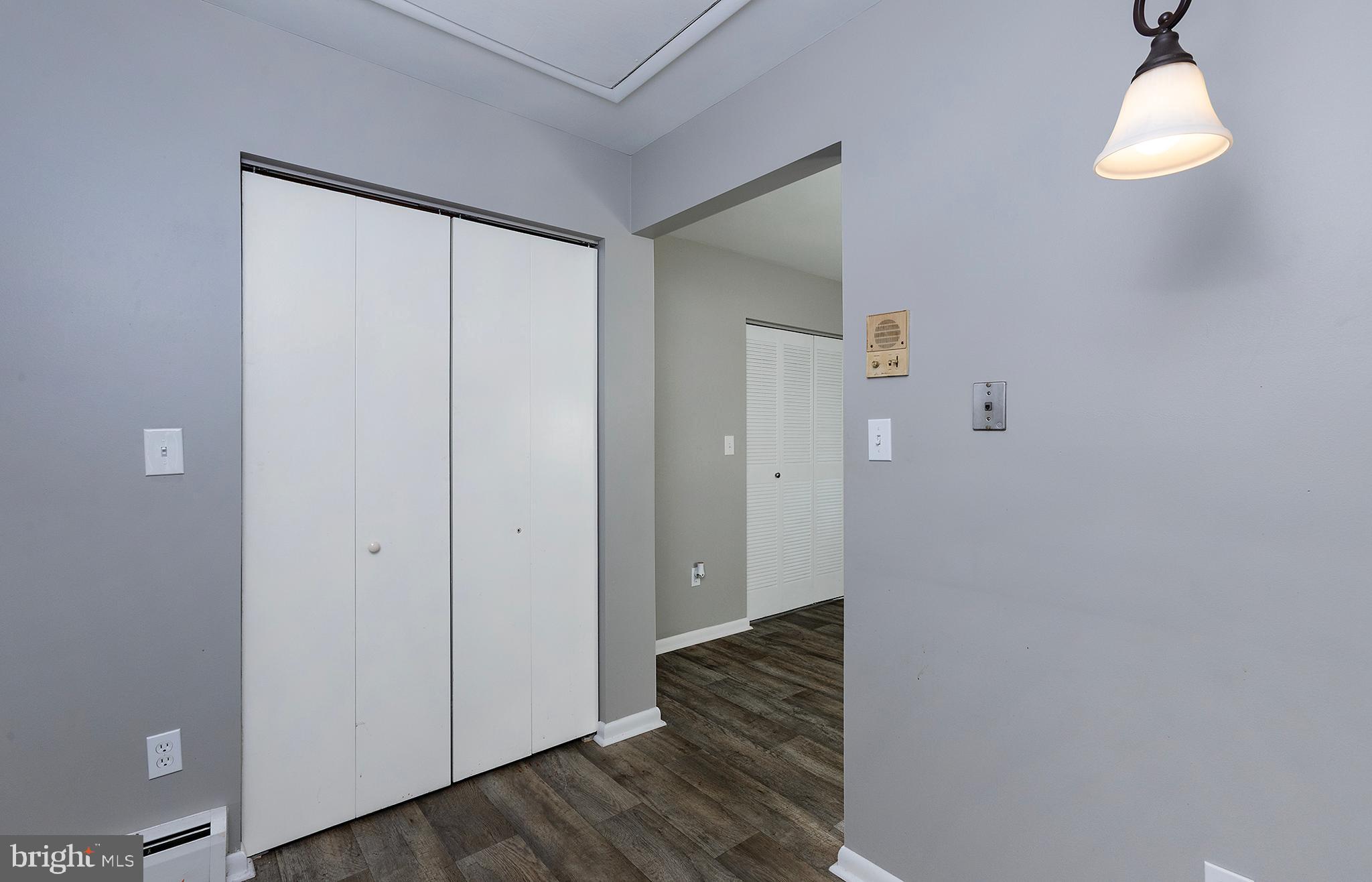 110 Sunset Avenue, Unit 201 Harrisburg, PA 17112 - Photo 9 of 22 a view of a hallway with wooden floor and staircase