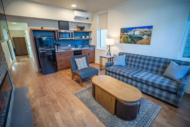 a living room with furniture and a rug