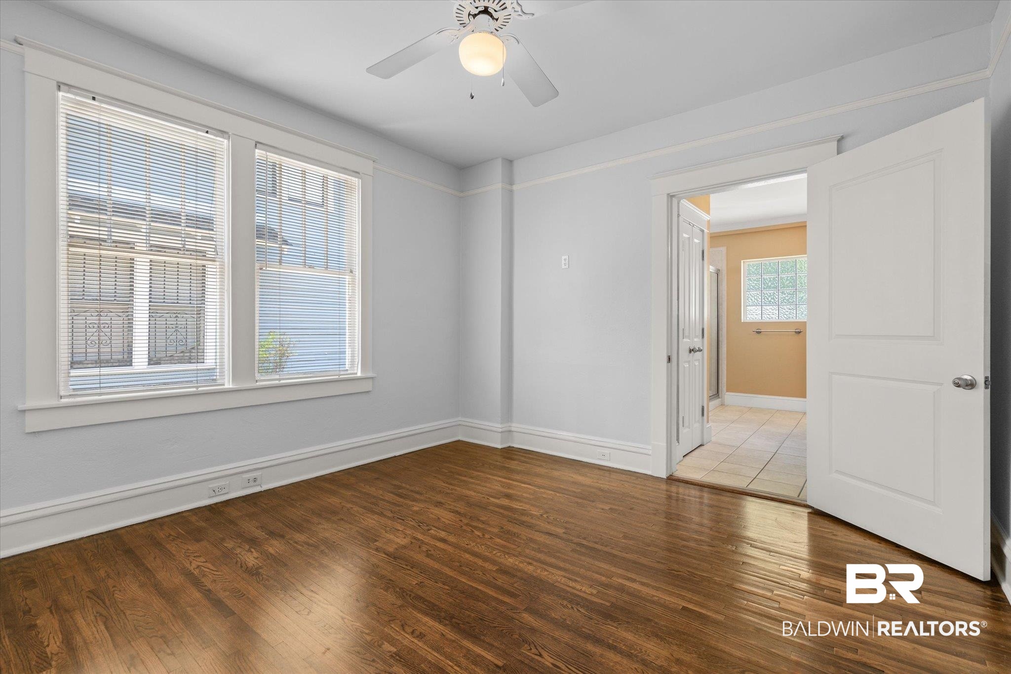 24 Macy Place Mobile, AL 36604 - Photo 22 of 38 Empty room featuring light wood finished floors, a ceiling fan, and baseboards