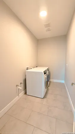 a utility room with a washer and dryer