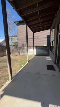 a view of a back yard from a balcony