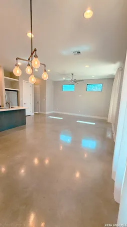 a view of a game room with a fan