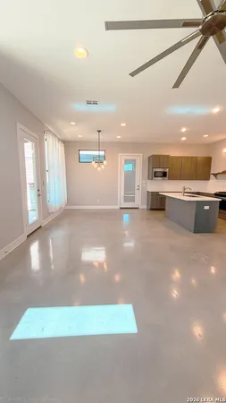 a view of a living room with kitchen