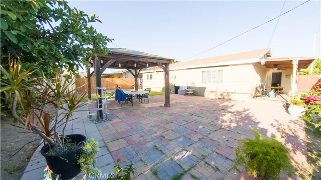 a view of a porch with furniture and a yard