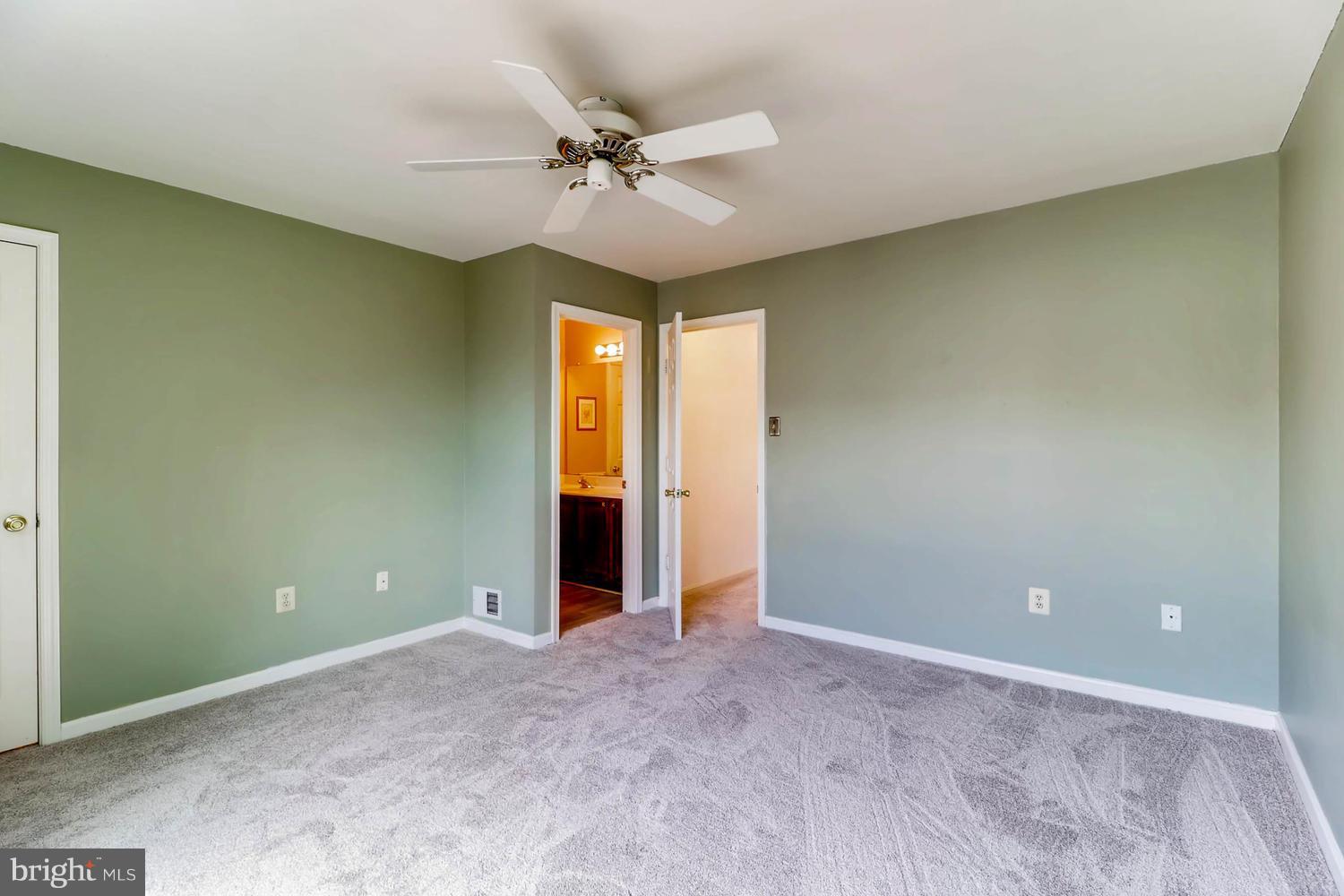 4414 Cole Farm Road Baltimore, MD 21236 - Photo 16 of 30 an empty room with a ceiling fan and a window
