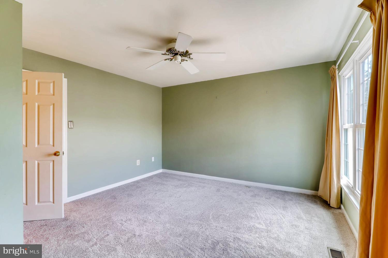 4414 Cole Farm Road Baltimore, MD 21236 - Photo 17 of 30 a view of an empty room with a window