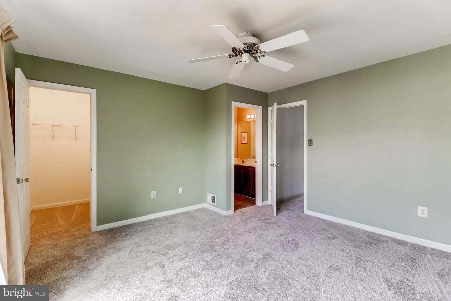 4414 Cole Farm Road Baltimore, MD 21236 - Photo 18 of 30 an empty room with closet and fan