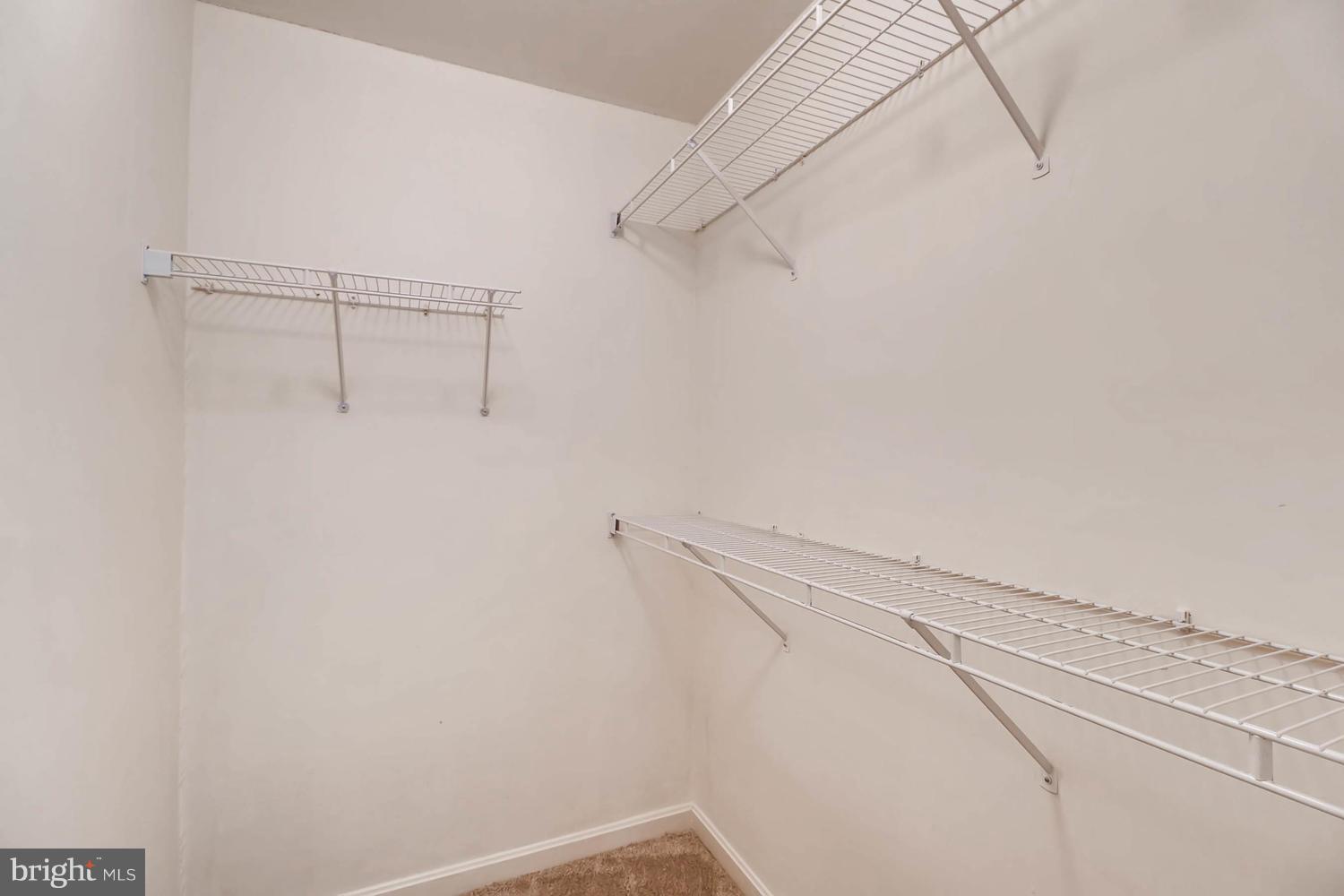 4414 Cole Farm Road Baltimore, MD 21236 - Photo 21 of 30 a view of a room with racks on the wall