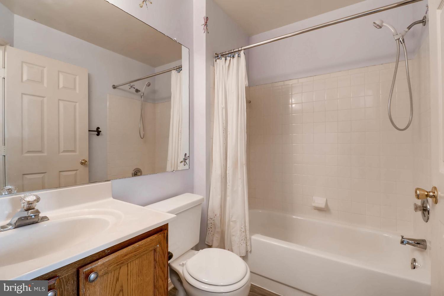 4414 Cole Farm Road Baltimore, MD 21236 - Photo 26 of 30 a bathroom with a sink toilet and shower