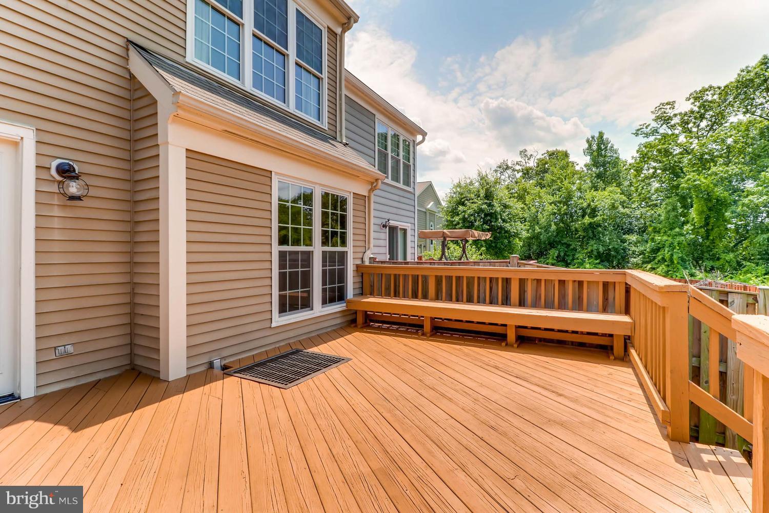 4414 Cole Farm Road Baltimore, MD 21236 - Photo 30 of 30 a view of a roof deck with wooden floor and fence