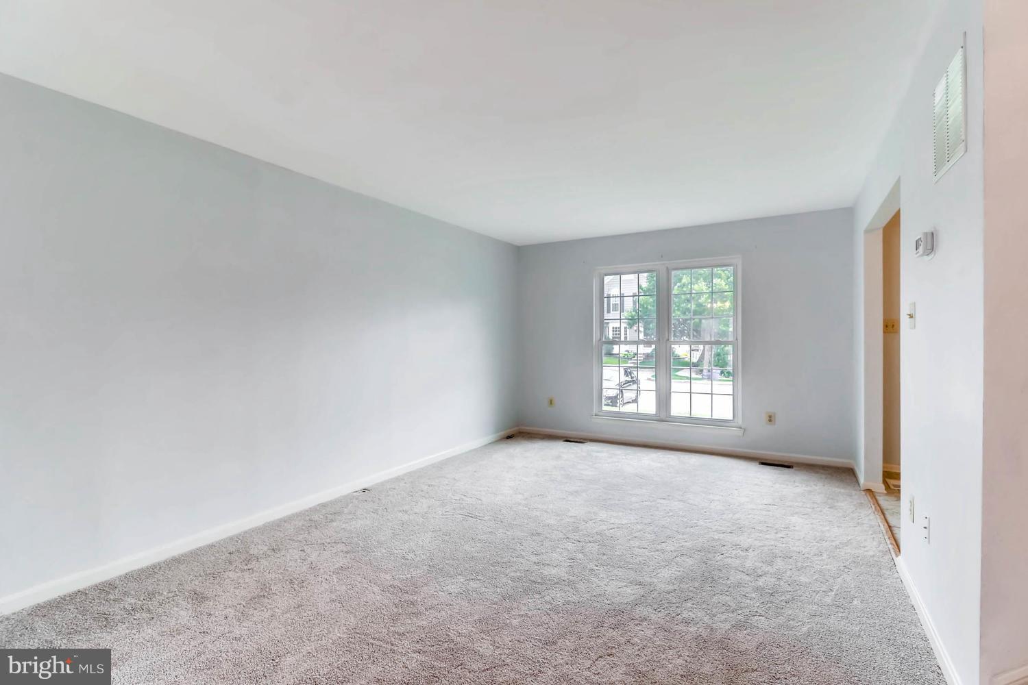 4414 Cole Farm Road Baltimore, MD 21236 - Photo 5 of 30 a view of an empty room with a window