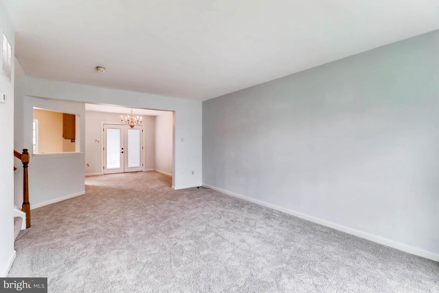 4414 Cole Farm Road Baltimore, MD 21236 - Photo 7 of 30 an empty room with a empty space and windows