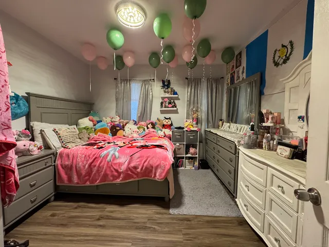a bedroom with bed and cabinets