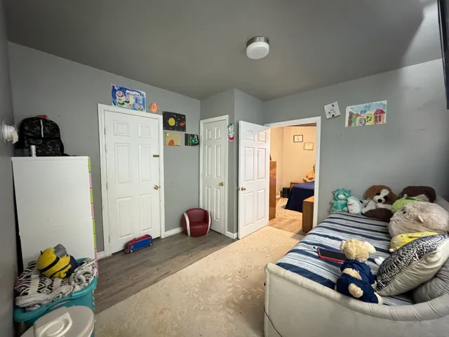 a living room with furniture and a bed