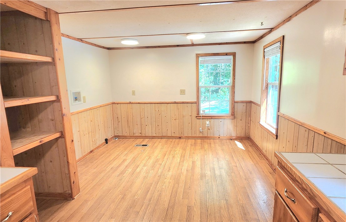 Dining area featuring built-in shelving.