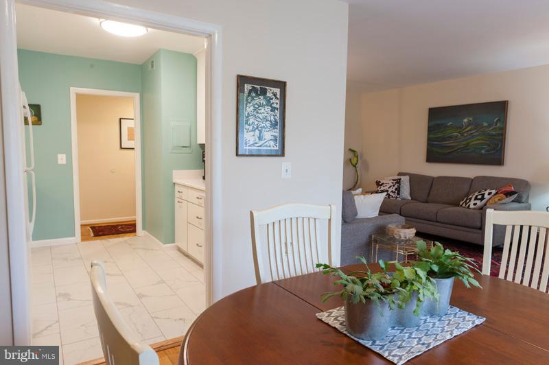 112 Cross Keys Road, Unit R112C Baltimore, MD 21210 - Photo 21 of 36 Kitchen flows to Dining Room