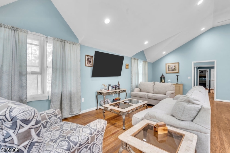 9 Mueller Lane Washington, NJ 07882 - Photo 11 of 45 a living room with furniture and a flat screen tv
