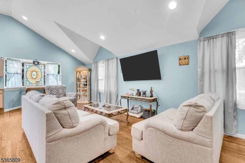 9 Mueller Lane Washington, NJ 07882 - Photo 12 of 45 a living room with furniture and a flat screen tv