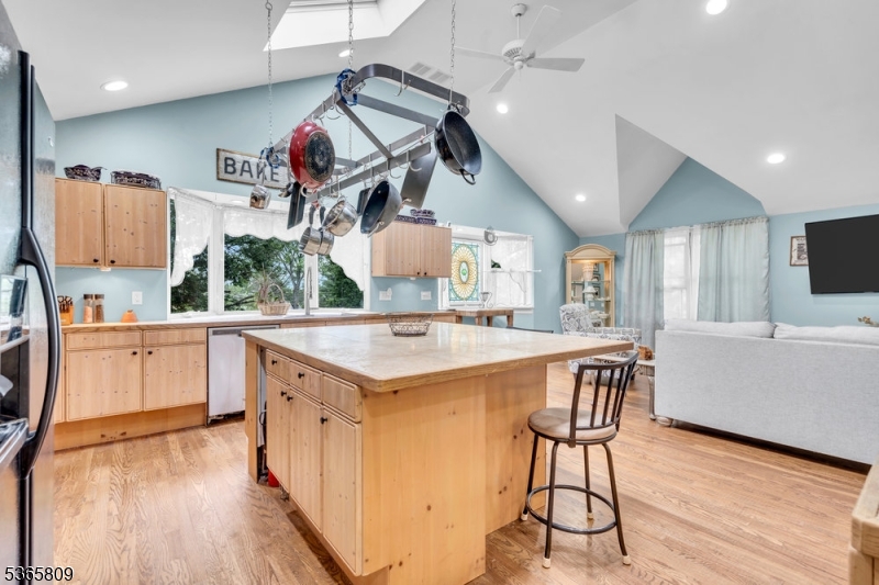 9 Mueller Lane Washington, NJ 07882 - Photo 15 of 45 a kitchen with a sink a stove and a wooden floor