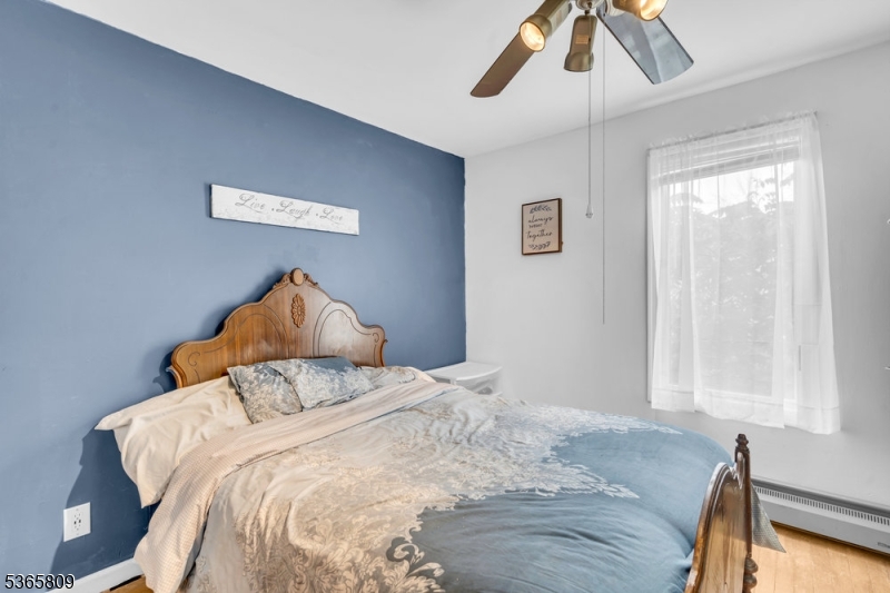 9 Mueller Lane Washington, NJ 07882 - Photo 23 of 45 a bedroom with a bed and a night stand