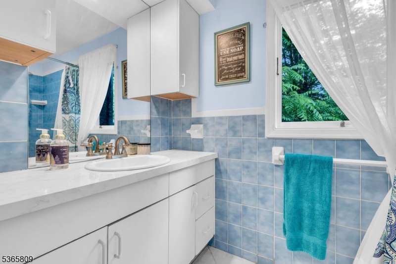 9 Mueller Lane Washington, NJ 07882 - Photo 26 of 45 a bathroom with a sink and a mirror