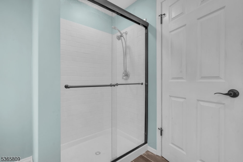 9 Mueller Lane Washington, NJ 07882 - Photo 28 of 45 a bathroom with a glass shower door