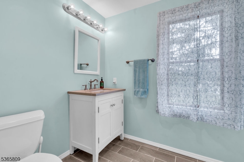 9 Mueller Lane Washington, NJ 07882 - Photo 29 of 45 a bathroom with a sink a toilet and shower