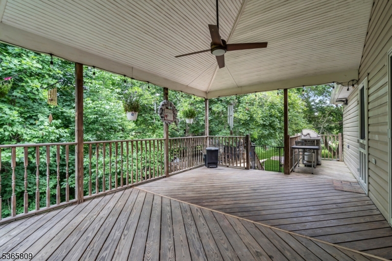 9 Mueller Lane Washington, NJ 07882 - Photo 33 of 45 a view of a balcony with chairs and wooden floor