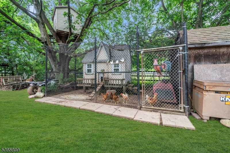 9 Mueller Lane Washington, NJ 07882 - Photo 36 of 45 a view of a chair and table in the back yard of the house