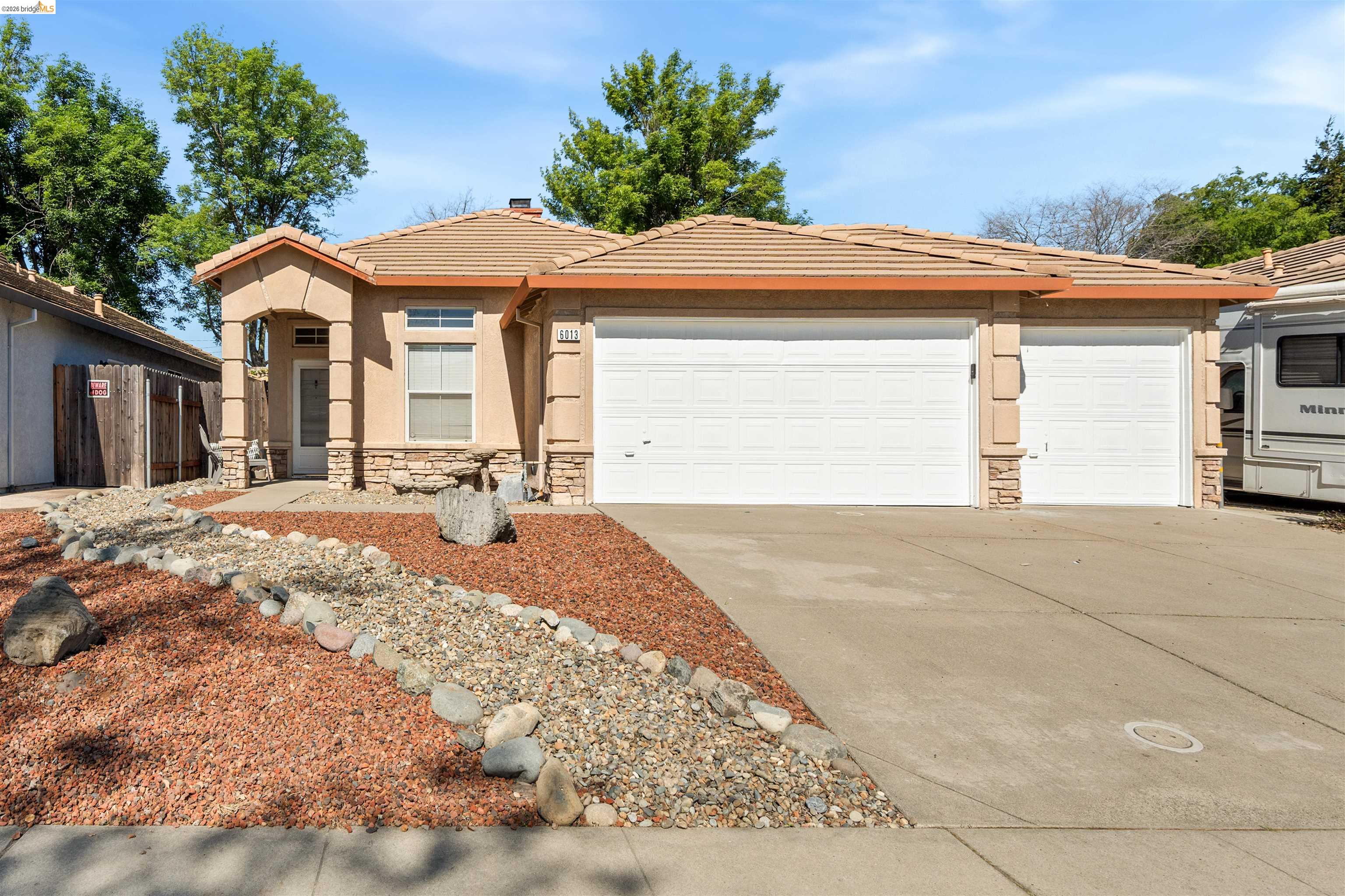 6013 Bach Court Citrus Heights, CA 95621 - Photo 1 of 1 a front view of a house with a yard and garage