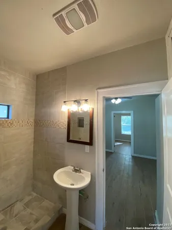 a bathroom with a sink and a mirror